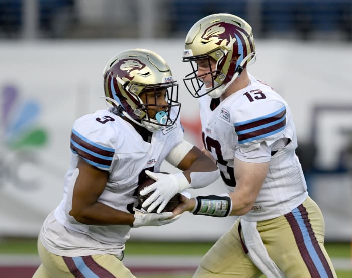 Michigan Panthers quarterback E.J. Perry hands off to Reggie Corbin in the second quarter of the USFL North Division Championship, Saturday, June 24, 2023, in Canton.